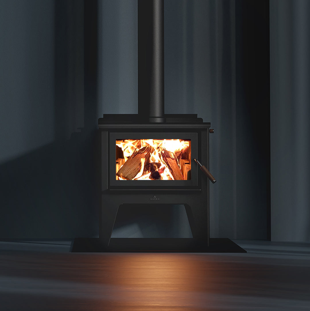 Maxen fireplace with flames inside, dark room setting
